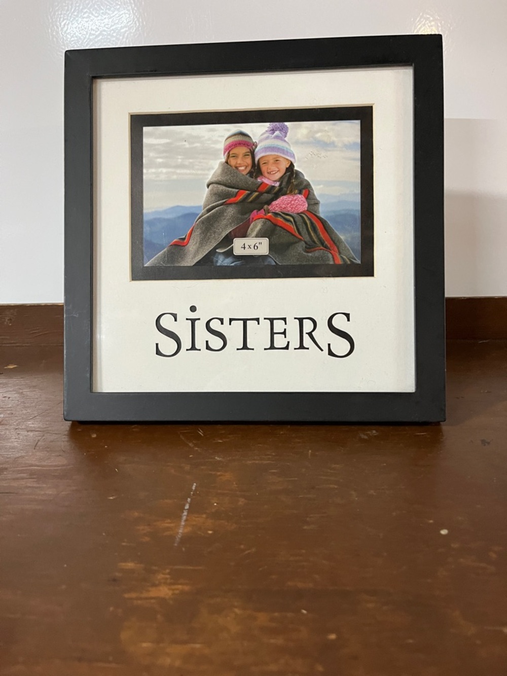Sister’s picture frame. Holds a 4x6 picture inside of a 9 1/2” x 9 1/2”frame.